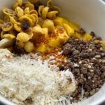 high protein yogurt bowl vanilla bee pollen mango banana raw honey granola chocolate cereal coconut